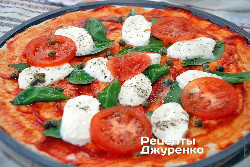 Розкласти кружечки помідора.