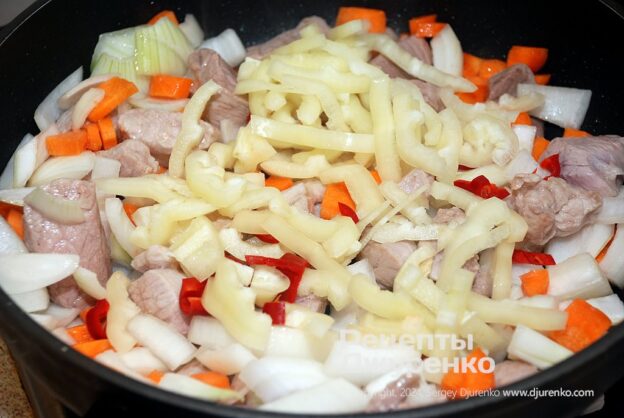 Add the cut vegetables to the meat and fry everything together.